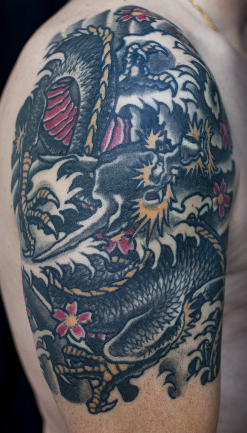 Drachentattoo auf Oberarm von Besen - Wild At Heart